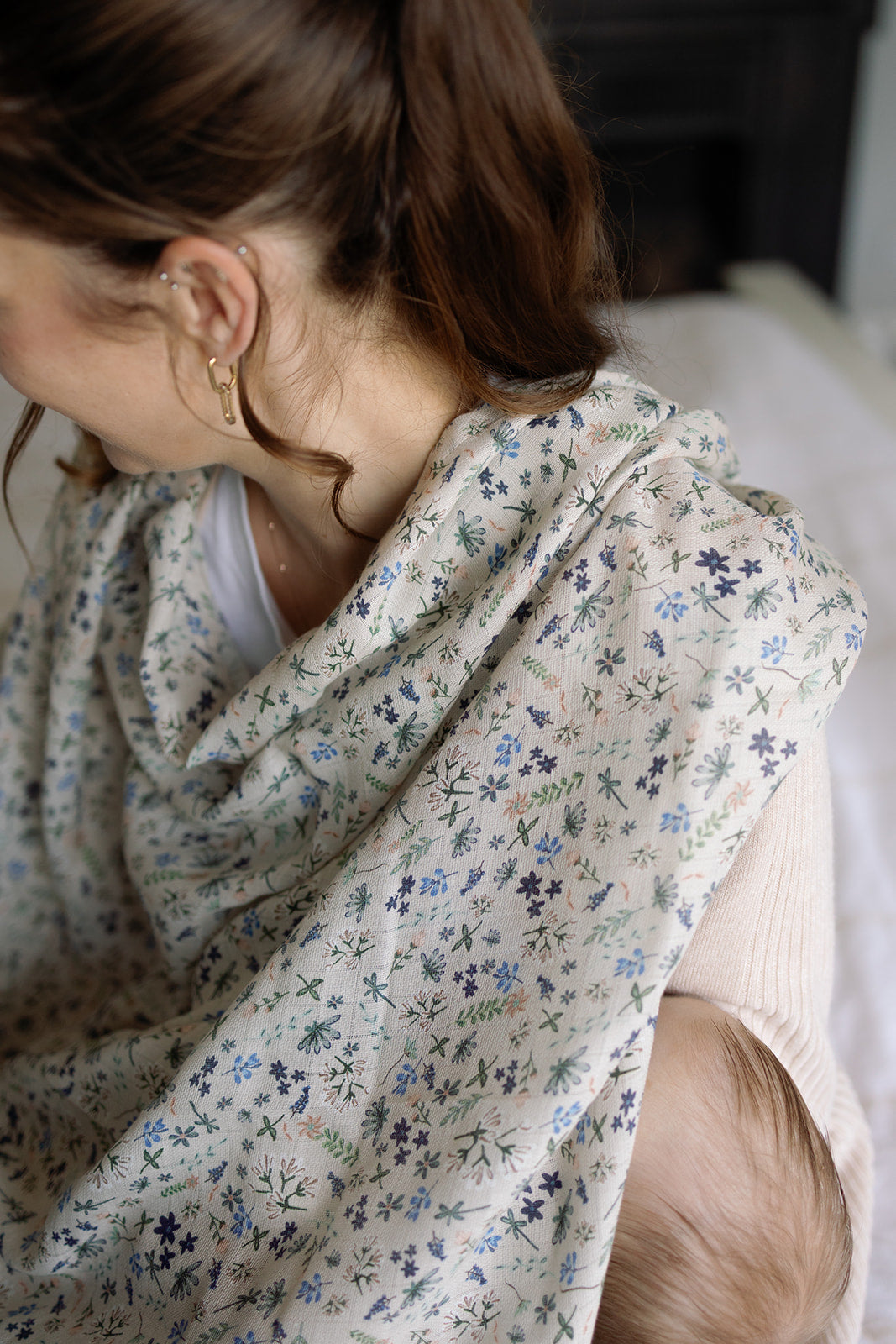 Woman wearing a floral scarf with a blurred background