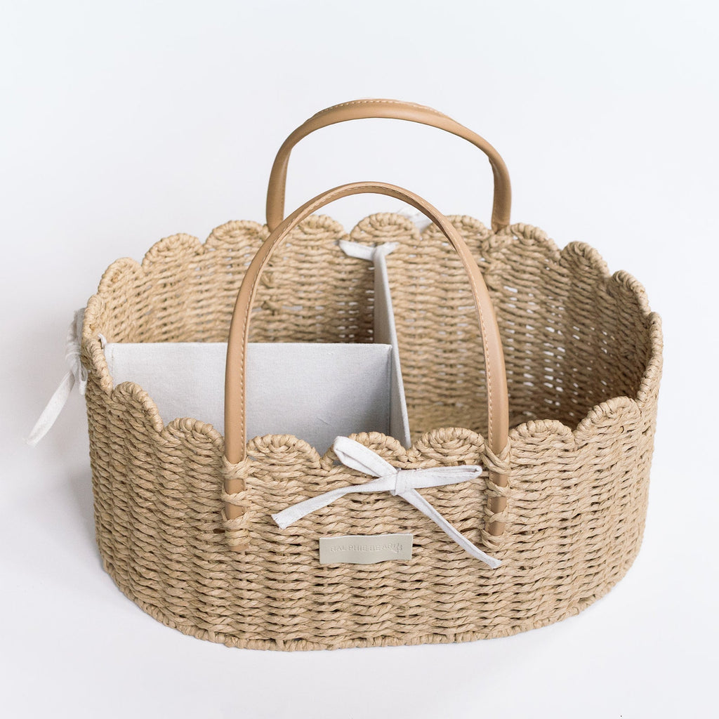Woven basket with handles on a white background