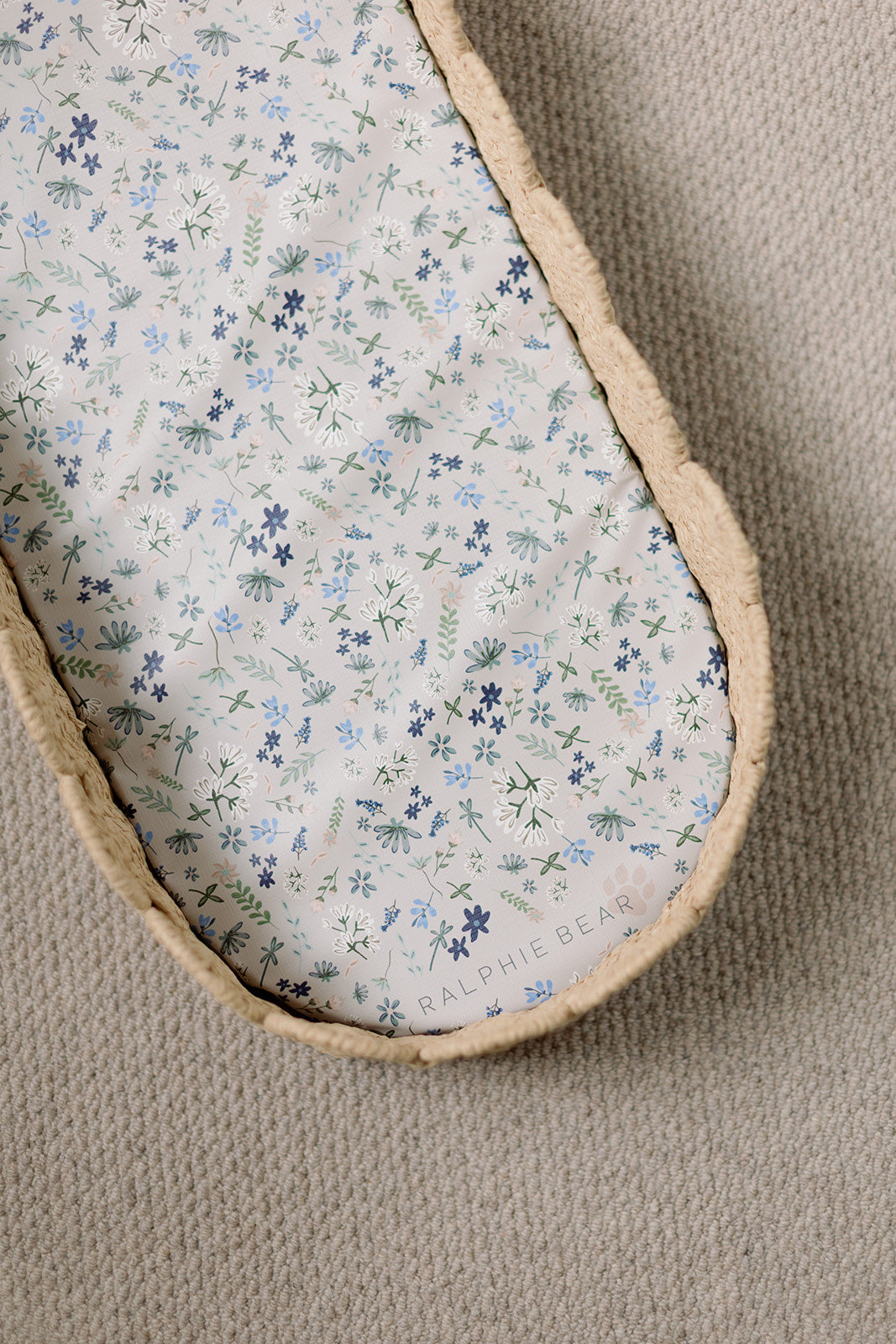 Floral-patterned fabric inside a shoe on a beige background