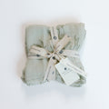 Folded fabric with a ribbon and tags on a white background