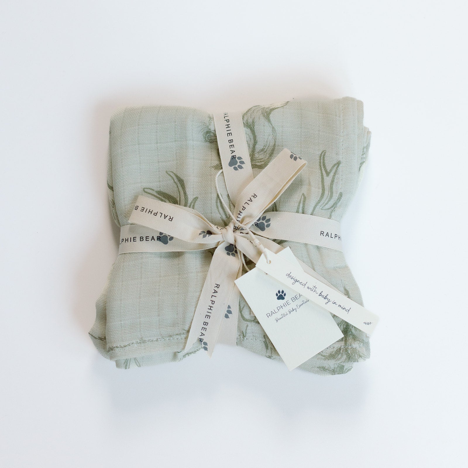 Folded fabric with a ribbon and tags on a white background