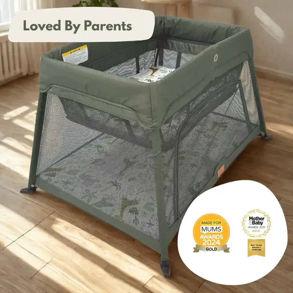 Green baby playpen on a wooden floor with 'Loved By Parents' and awards badge.