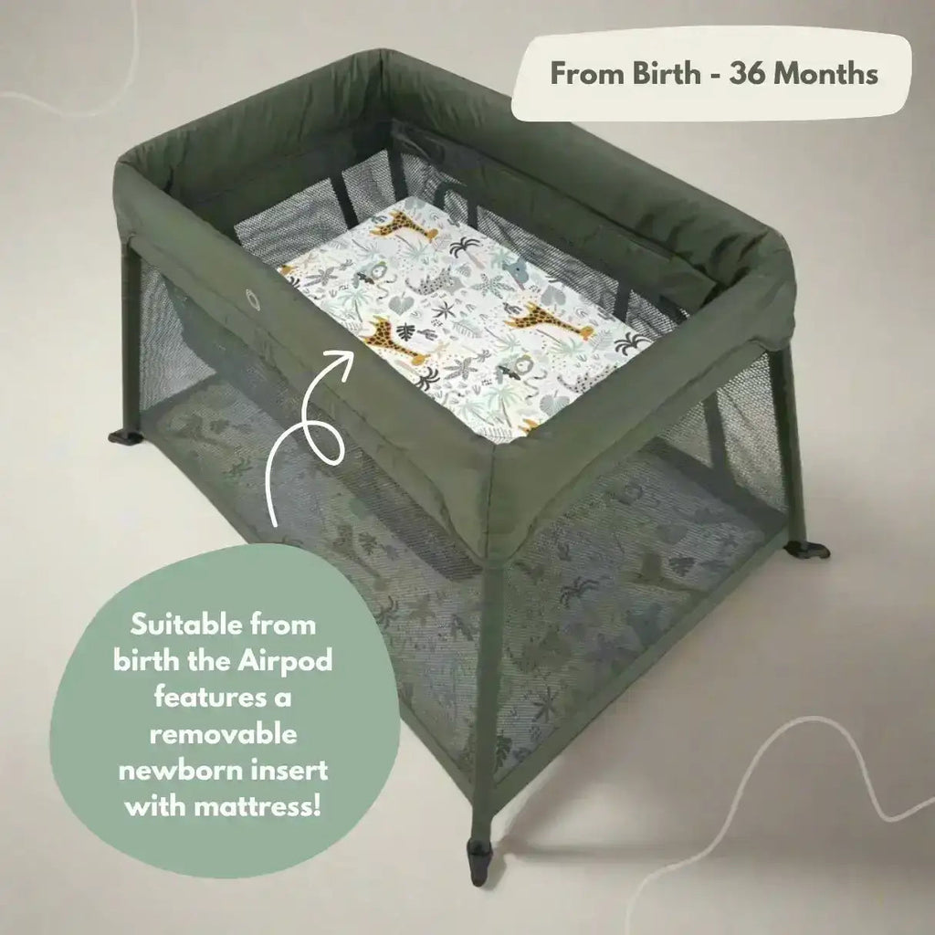 Green baby playpen with a removable newborn insert on a light gray background