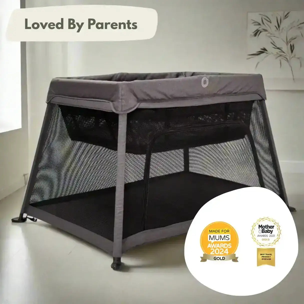 Portable crib with 'Loved by Parents' and awards badge on a neutral background