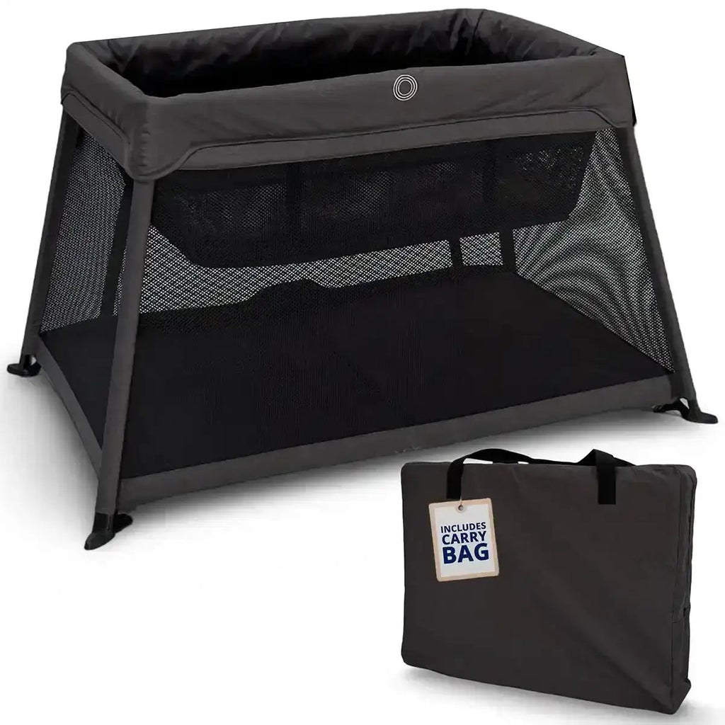 Black portable crib with a carrying bag on a white background