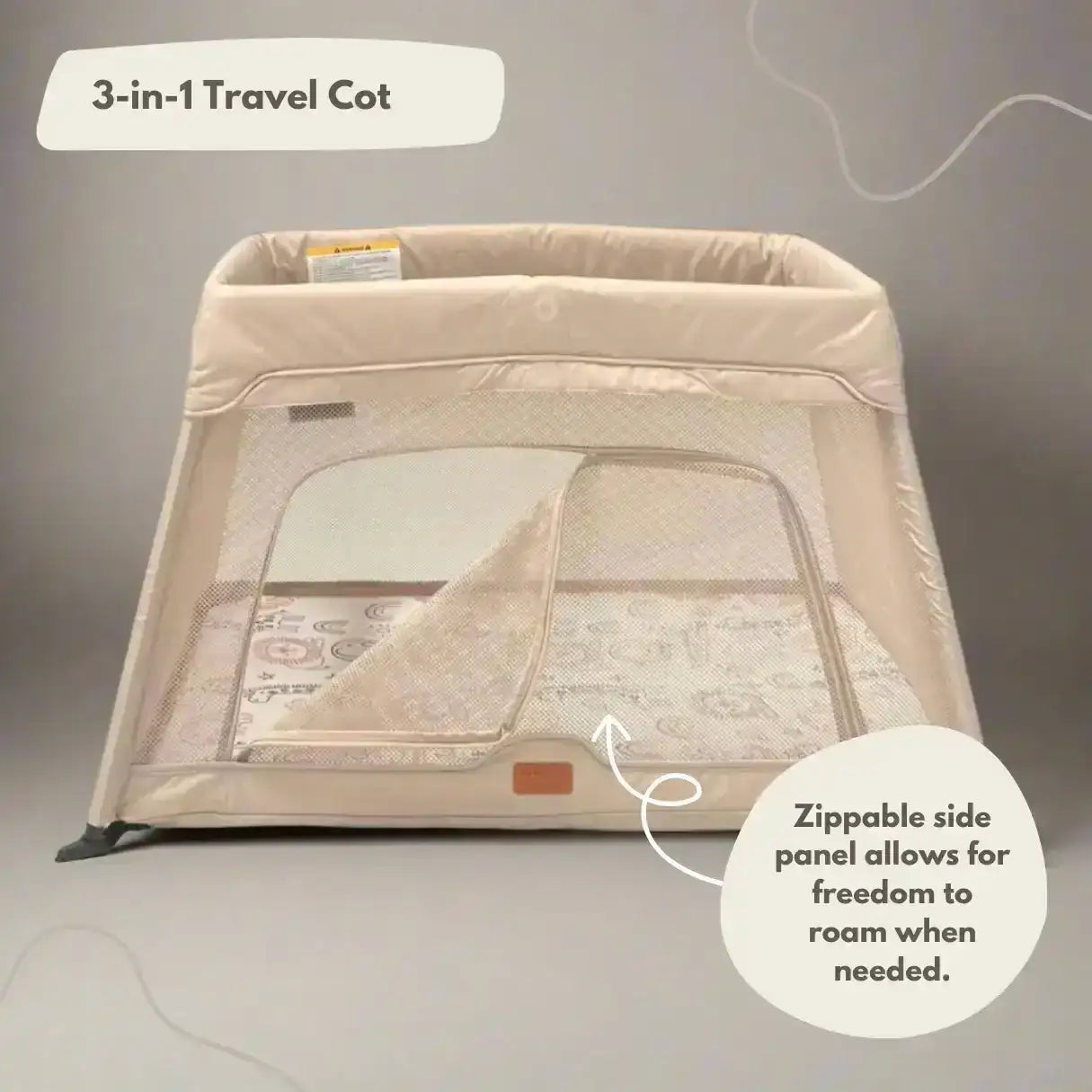 Beige 3-in-1 travel cot with zippable side panel on a neutral background