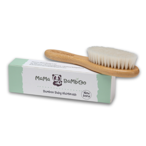 Bamboo baby hairbrush with packaging on a white background