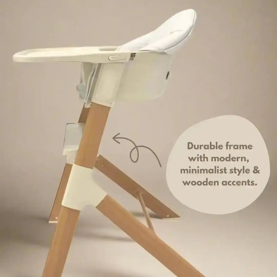 Wooden high chair with white seat on a beige background