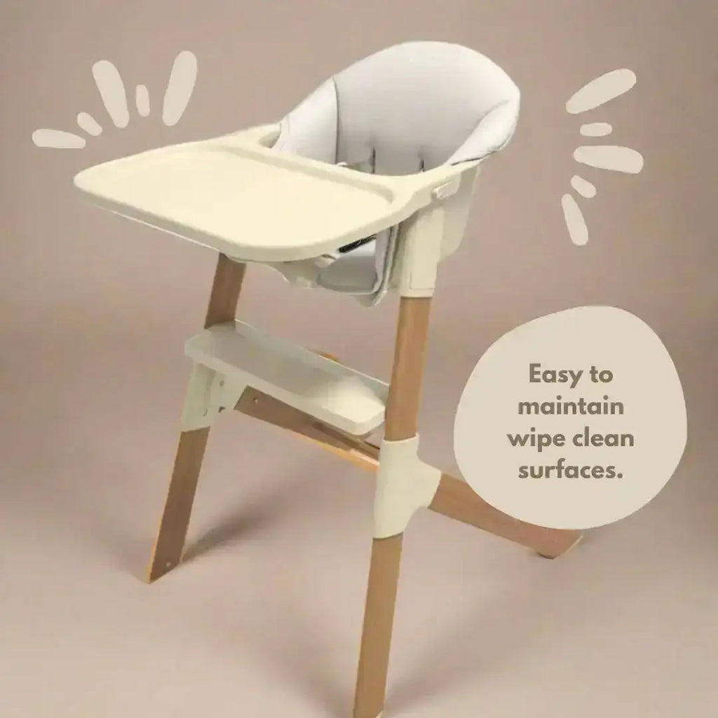 White and beige high chair with text on a beige background