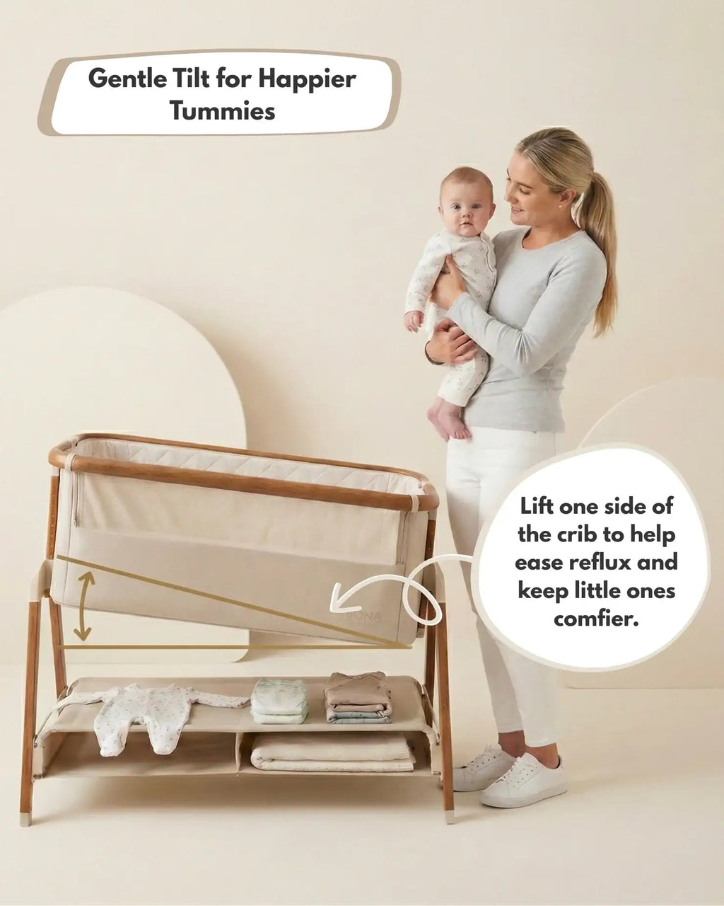 Woman holding a baby next to a wooden crib with text about its benefits