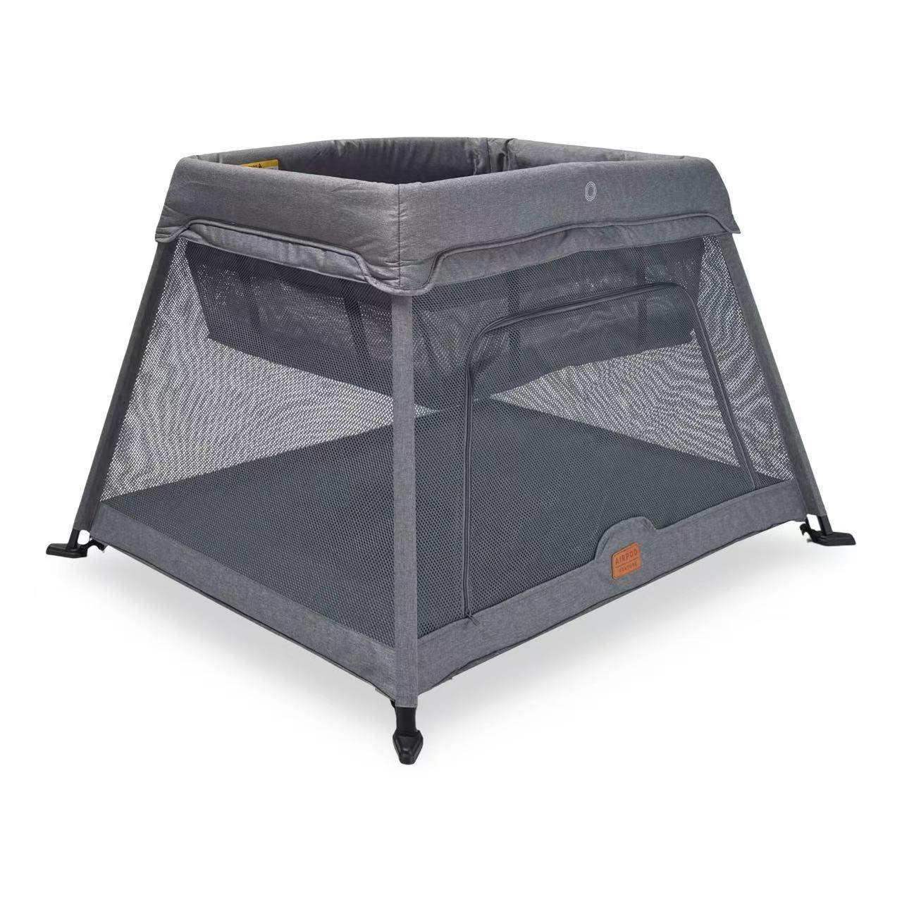 Gray portable crib with mesh sides on a white background