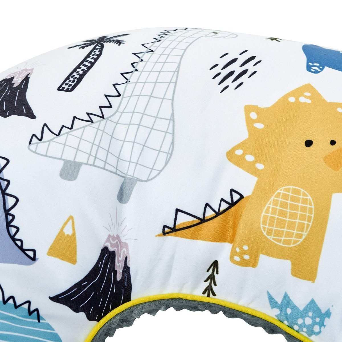 Children's pillow with dinosaur and volcano design on a white background