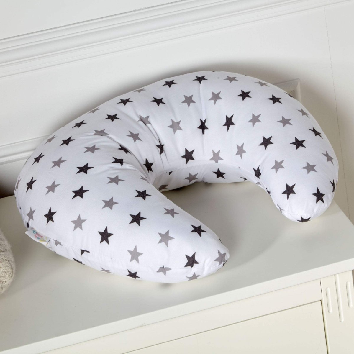Boppy pillow with star pattern on a white surface