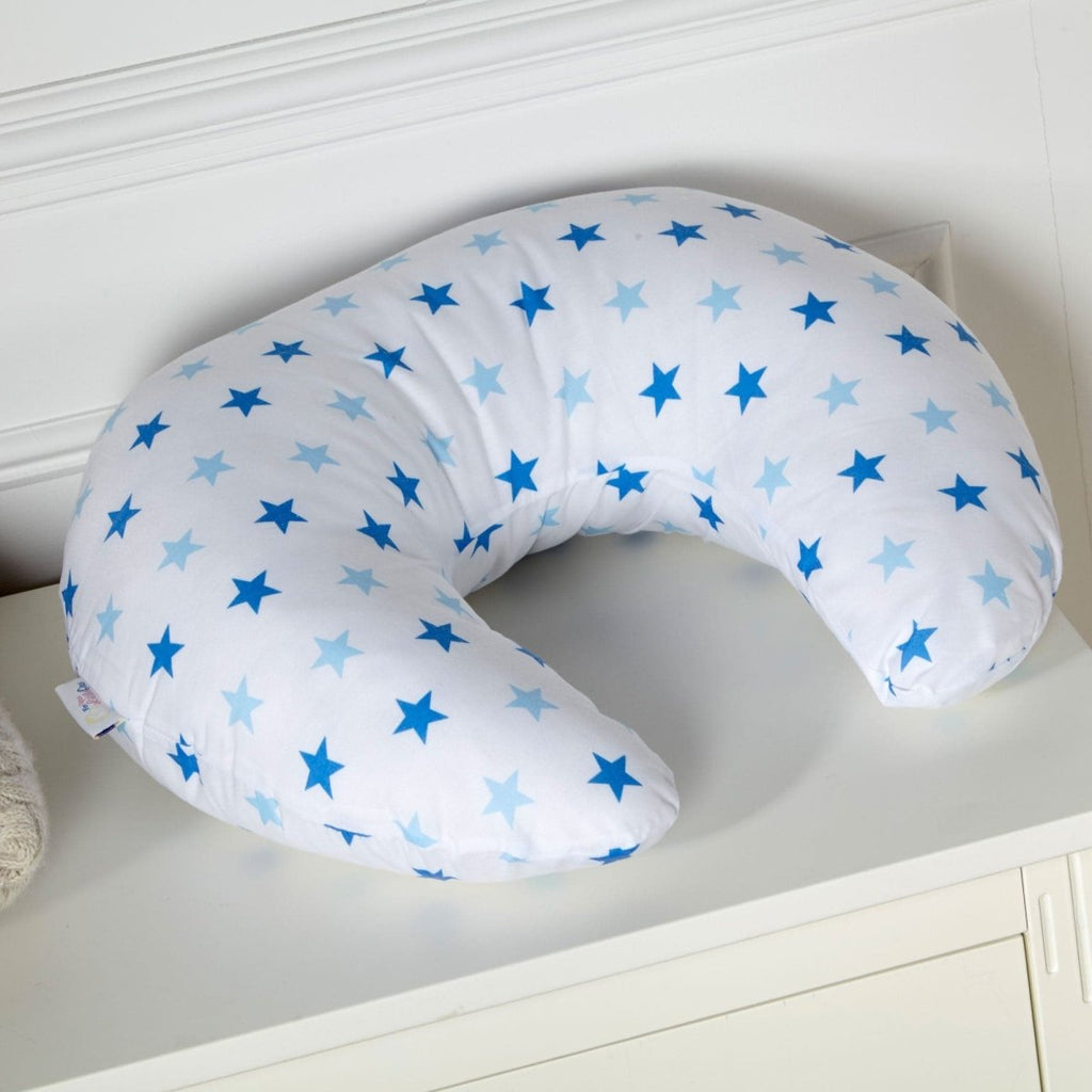 U-shaped pillow with blue star pattern on a white surface