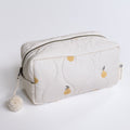White pouch with pear pattern and pom-pom on a light gray background